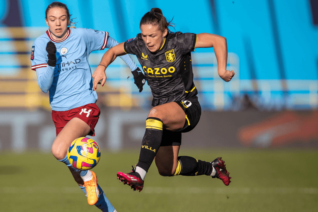 Female-Pro-Football-Dribbles-The-Ball-football4football