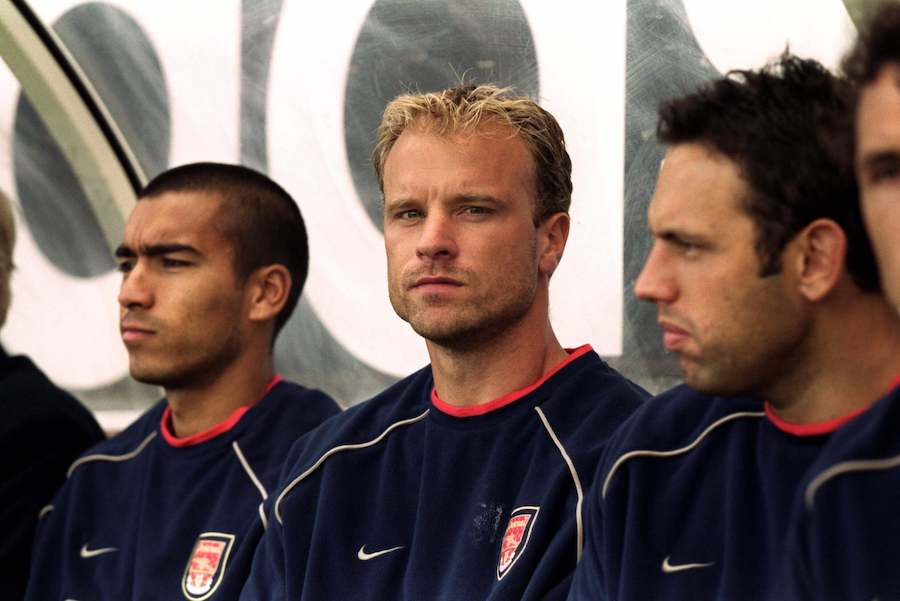 Arsenal-layers-sit-on-the-bench-during-a-football-match-football4football-squashed