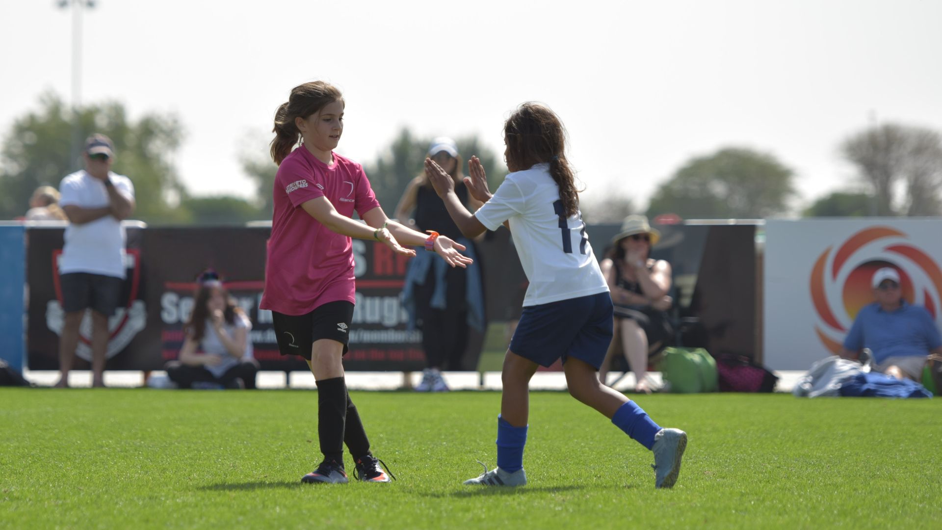 two-girl-footballers-celebrate-a-goal-football4football
