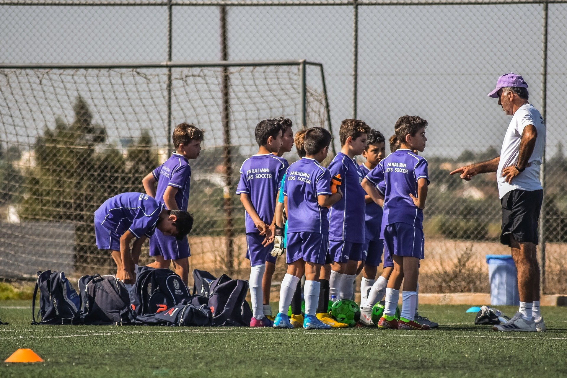 football-coach-speaks-to-young-players-football4football